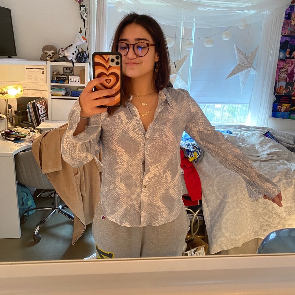 Snake pattern button blouse with ruffled sleeves